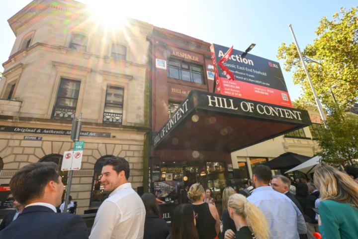 The crowd gathered outside the Hill of Content bookshop for Thursday’s auction.