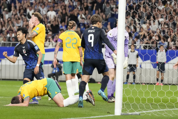 Burgess reacts after scoring Australia’s own goal.