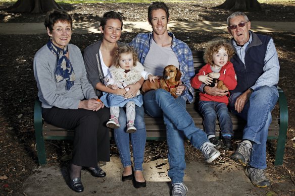 A family affair: Bob Murphy (centre) photographed in 2011 ahead of his 200th match for the Western Bulldogs with (from left) mother Monica, wife Justine, daughter Frankie, dog Arthur, son Jarvis and father John. The three generations are all Age readers.