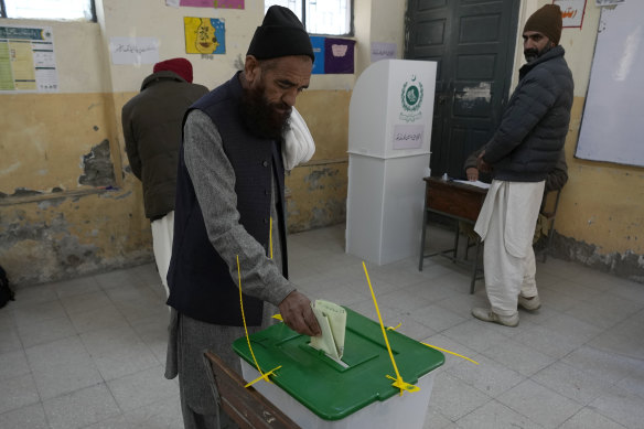 A Pakistani man casts his vote at a polling station in Islamabad.