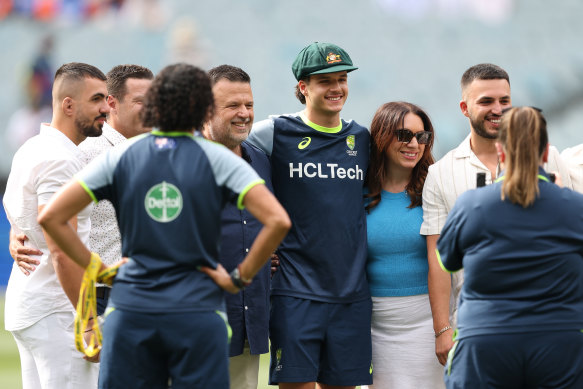 Sam Konstas with his family after receiving his baggy green before play on day one.