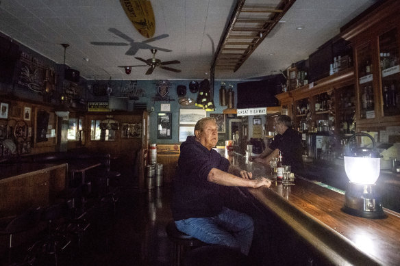Joseph Pokorski drinks a beer at The Town Square as downtown Sonoma remains without power.