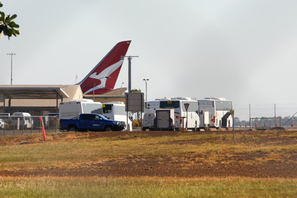 Buses wait to transport passengers from a flight to the Howard Springs quarantine facility.