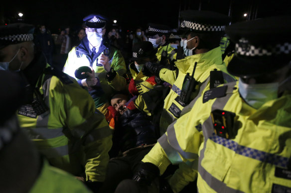  A member of public is arrested during a vigil for Sarah Everard in London on Saturday.