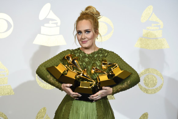 Adele with the Grammys she won for her last album, 25, which she released in 2015.