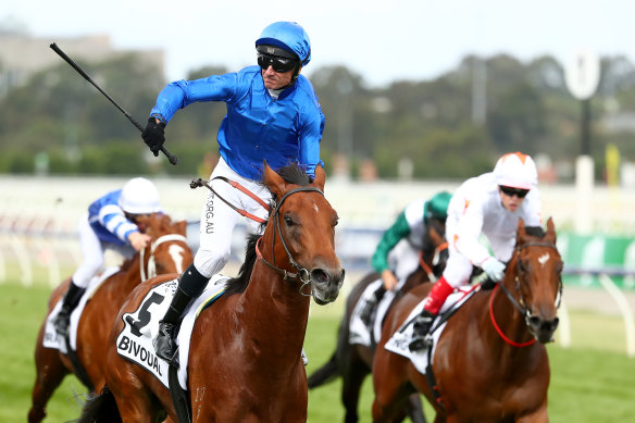 Glen Boss steers Bivouac to victory in the Newmarket Handicap at Flemington on Saturday. Craig Williams on Loving Gaby finished second.