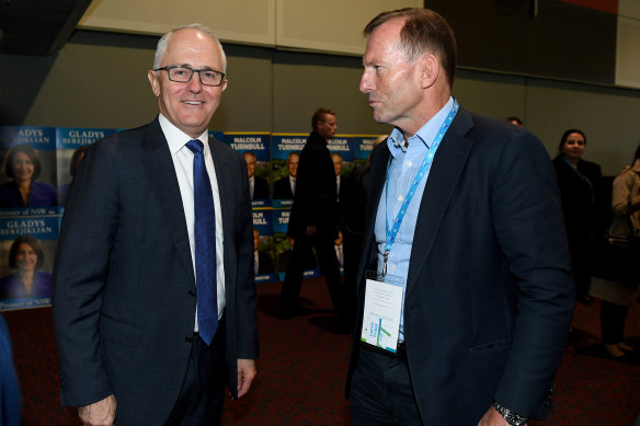 Malcolm Turnbull and Tony Abbott cross paths at a Liberal Party convention in 2017.