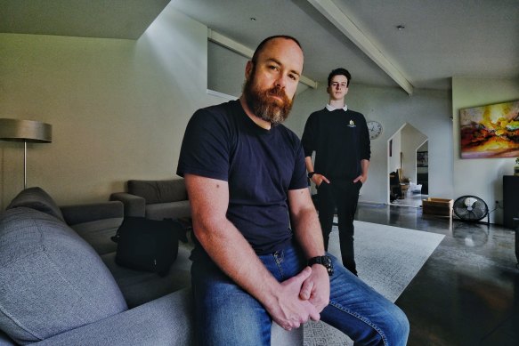 Travis Tait and his son Xander who is sitting his year 12 exams while power has been cut to their home in Montrose. 