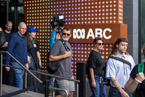 ABC staff stream out of their offices last month.
