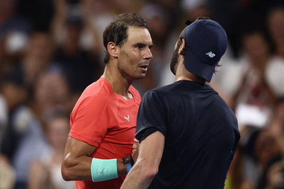 Rafael Nadal and Jordan Thompson shake hands after the match.