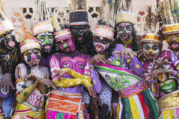 Folk dancers from the Sahariya tribe pose for a photo before the start of a road show for French President Emmanuel Macron and Indian Prime Minister Narendra Modi in Jaipur, Rajasthan, India, on Thursday.
