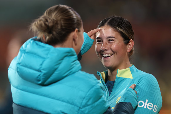 Kyra Cooney-Cross shares a smiley moment with Steph Catley.