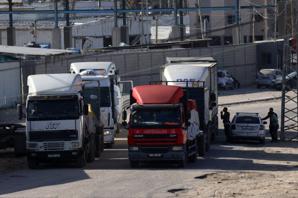 Trucks carrying humanitarian aid enter the Gaza Strip via the Rafah crossing with Egypt.