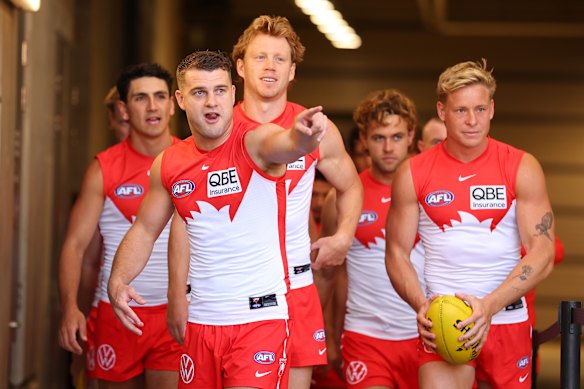 Tom Papley leads the Swans out for his 200th game.