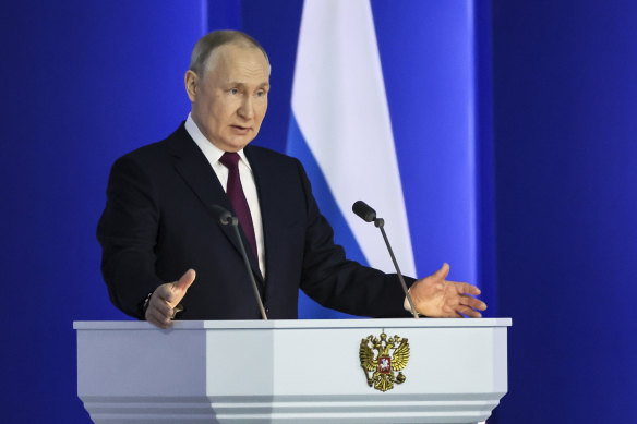 Russian President Vladimir Putin gestures as he gives his annual state of the nation address in Moscow.
