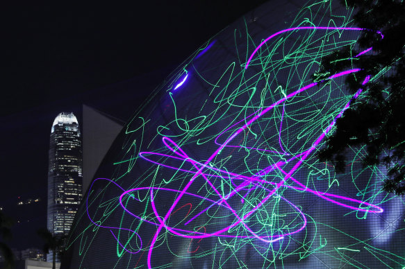 Protesters use laser pointers to light the Hong Kong Space Museum during a rally to demonstrate against the arrests of people caught in possession of laser pointers early on Wednesday morning.