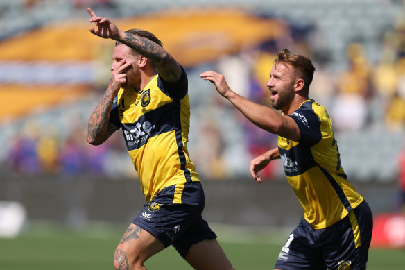 Jason Cummings celebrates his homecoming goal for the Mariners against Newcastle.