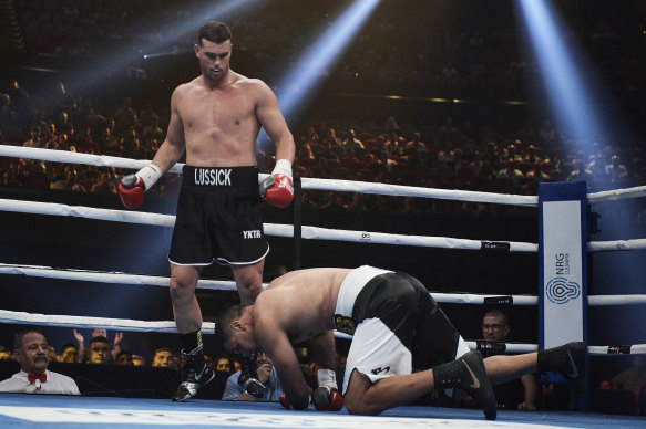 Darcy Lussick stands over Justin Hodges. The fight lasted just 39 seconds.