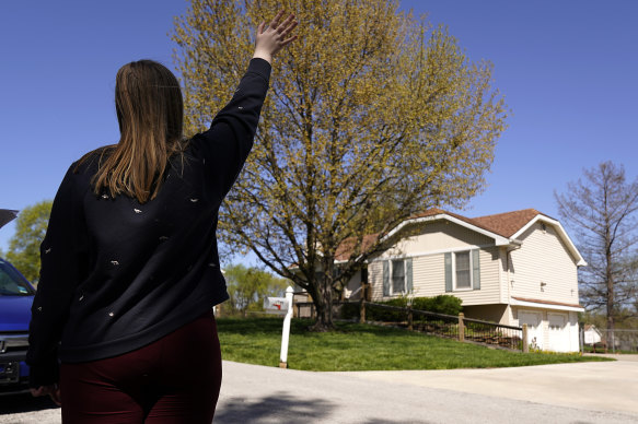 One of Yarl’s classmates looks at the house where he was shot.