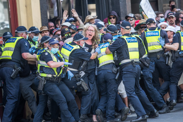 Police encircle protesters as tensions flare.