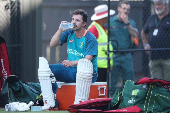Travis Head takes a drinks break at training on Tuesday while he prepares for a Test match at his home ground, the Adelaide Oval.