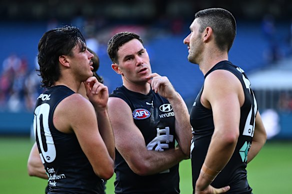 Time to ponder: The Blues looked dejected after their defeat.