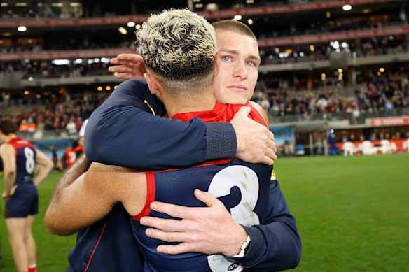 Adam Tomlinson shed a tear after the Dees beat the Cats to make the grand final.
