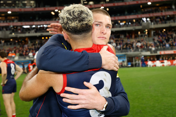 Adam Tomlinson shed a tear after the Dees beat the Cats to make the grand final.
