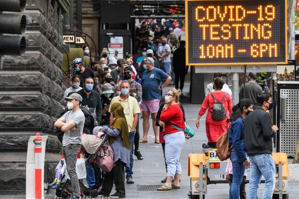 Huge queues formed early for coronavirus testing at the Melbourne Town Hall on Christmas Day. 
