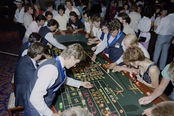 Croupiers and crowds at the casino’s soft opening night for members and family of the BLF on December 27, 1985.