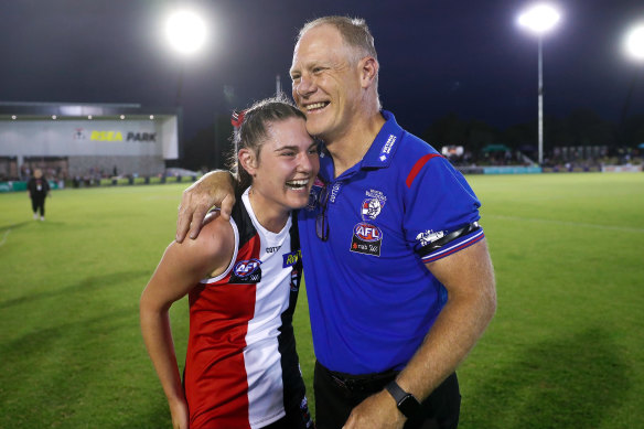 No hard feelings: Alice and Nathan Burke embrace after the game.