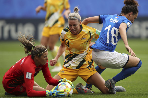 Australian goalkeeper Lydia Williams and teammate Clare Polkinghorne put a stop to Italy's Ilario Mauro.