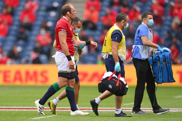 Lions captain Alun Wyn Jones is led from the field by medics after injurying his shoulder.