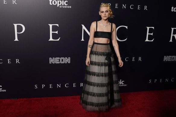 Kristen Stewart in Chanel, the star of “Spencer,” poses at the premiere of the film at the Directors Guild of America.