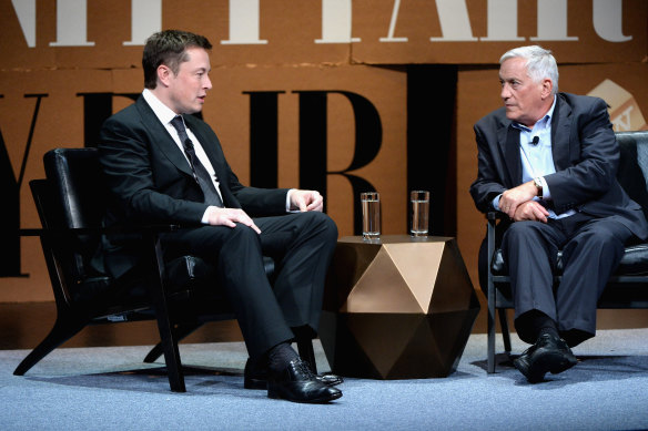 Elon Musk and his biographer Walter
Isaacson at a 2014 conference.