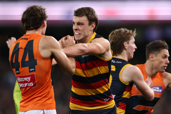 Tempers flare between Riley Thilthorpe of the Crows and Jack Buckley of the Giants.