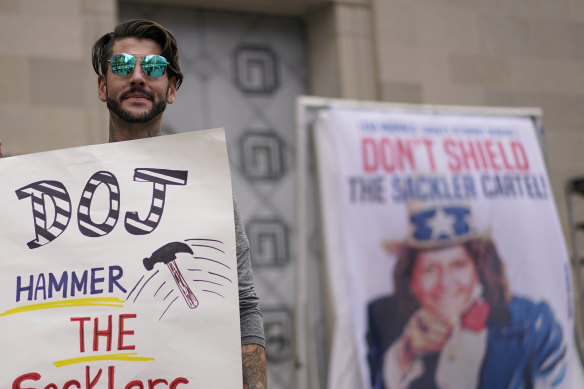 Nicholas Rivers of Maine protests outside the Department of Justice in Washington. 