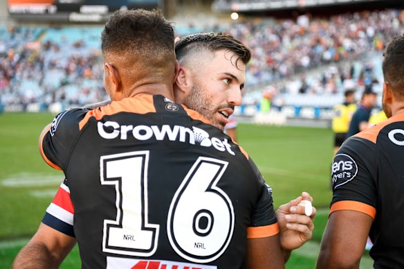 James Tedesco hugs former Tigers teammate Michael Chee Kam after a round one loss in 2018.