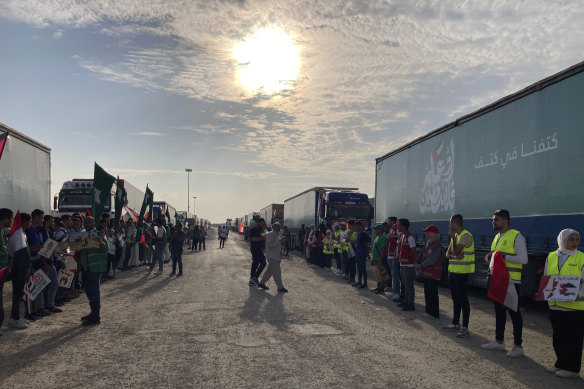 Volunteers and aid trucks at the Rafah border crossing between Egypt and Gaza Strip.