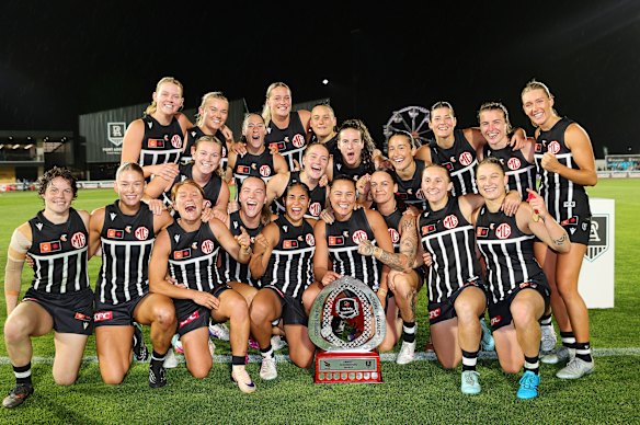 Port Adelaide celebrate their win over Adelaide.