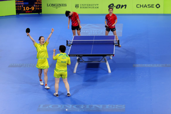 Jee Minhyung (L) and Jian Fang Lay of Team Australia celebrate victory in the early rounds.