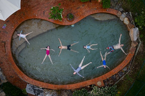 The Mayes family cool off in their pool in western Sydney as temperatures reached over 40 degrees on Thursday.