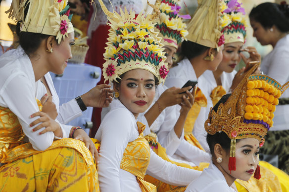 Balinese dancers wearing traditional dress at the Kuningan festival.  Indonesia had not previously detected any cases of coronavirus.