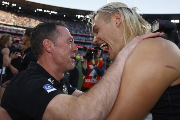 Awestruck: Collingwood coach Craig McRae and Darcy Moore.