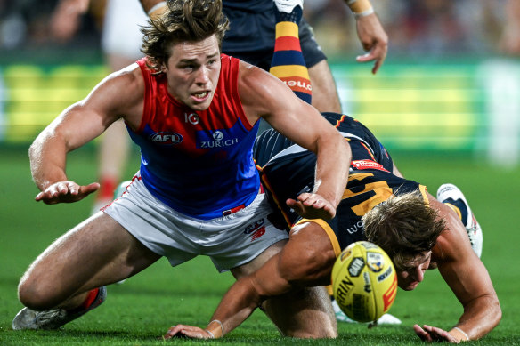 Melbourne’s Tom Sparrow in a ferocious battle for the ball.