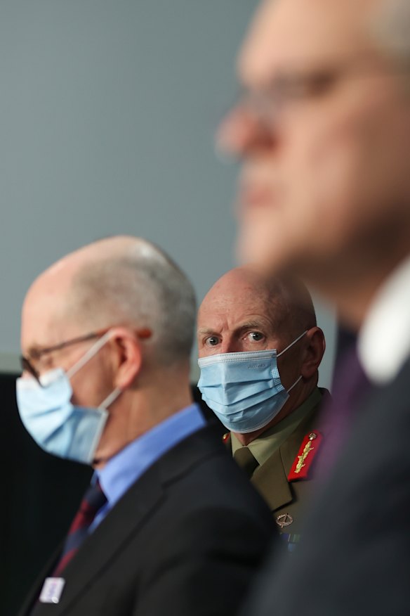 Chief Medical Officer Professor Paul Kelly, COVID-19 Taskforce Commander, Lieutenant General John Frewen and Prime Minister Scott Morrison at Parliament House on Friday. 
