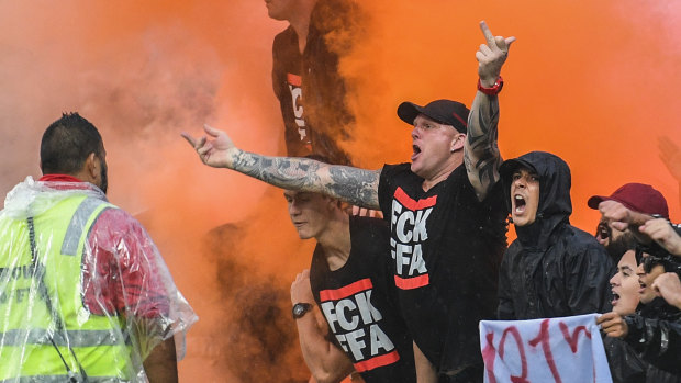 Tensions flare: The Red and Black Bloc react after an Oriol Riera goal for Wanderers against Sydney FC in the derby.