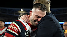James Tedesco is consoled by Trent Robinson.