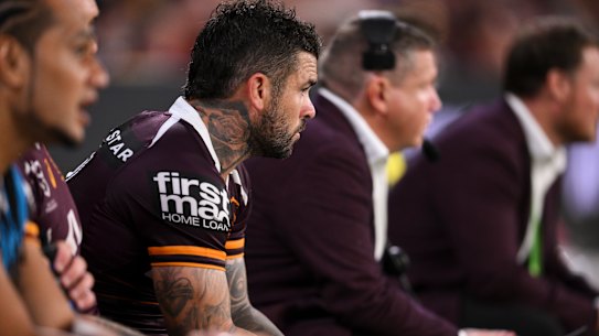 Adam Reynolds watches on from the sidelines after leaving the field in the Brisbane Broncos’ win against Wests Tigers.
