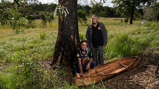 Uncle John Kelly and Uncle Harry Ritchie with the canoe made as part of the community project.